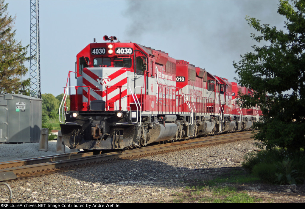 After dragging its heels up Duplainville siding to give the re-crewing M345 a head start, T003 re-enters the main and puts the hammer down